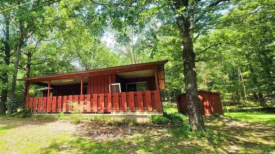 Relaxing! This is a cozy cabin style home located at 463 Timber Road in Fairfield Bay. With 2 bedrooms and 1 bath and the potential for a third bedroom/office, it is perfect for your weekend getaway. Has a large open floor plan to enjoy your family & friends. Covered carport with an outside shed for storage. Fairfield bay has three community pools, Greers Ferry Lake, Fairfield Bay Marina, many local restaurants, shopping, side by side trails and hiking trails and so much more. Come and sit on the front porch and enjoy the sunrise to sunset in a quiet tranquil location. Call or text today for a showing!