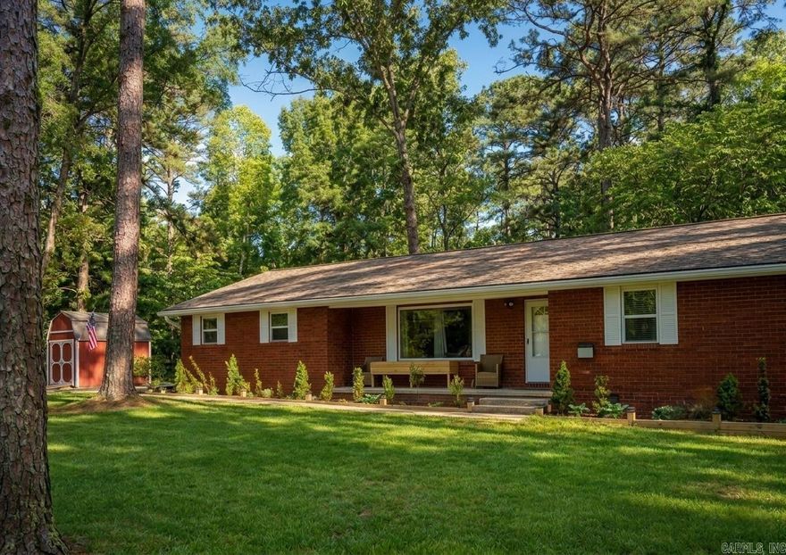 GREERS FERRY LAKE ACCESS RETREAT * 3.8 miles from Lacey’s Marina = convenient lake access.  Furniture options available to convey, as well as all stainless appliances which are less 4 years old. Every surface has been updated! The hall bath includes a soaking tub with subway tile surround. The primary on-suite provides a large custom walk-in shower, double vanity, & great storage! New energy-efficient thermal grid-free windows, luxury vinyl wood plank flooring, new paint & added disc lighting are just some of the quality finishes you'll find. The primary bedroom has a cozy sitting area—your own personal retreat. The spacious 13' × 15' covered & closed-in back deck is perfect for entertaining or relaxing while being pet friendly and baby safe. There is also a path to a pergola, which is perfect for taking in the beauty this property has to offer.  2.5 acres of flat, thoughtfully manicured trees create a peaceful private park-like setting. As an added bonus, the seller is including a one-year home warranty. 10 mins to shopping and dinning. 39 mi to Conway, 20 mi to Heber Springs & 20 mi to Clinton.