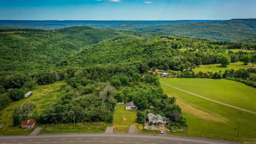 APPROX 1.93 ACRES. THERE IS A WELL, HIGHWAY FRONTAGE, AND NO RESTRICTIONS. FENCED ON THREE SIDES, HAS CITY WATER WITH THE METER AND PRESSURE VALVE INSTALLED, SEPTIC IS PROPOSED AND APPROVED, POWER IS ON THE PROPERTY JUST NEEDS HOOKED UP, RV AND MOBILES ARE ALLOWED. TWO CORNER PINS ON OPPOSITE SIDES AND ENDS THAT ARE VISABLE.