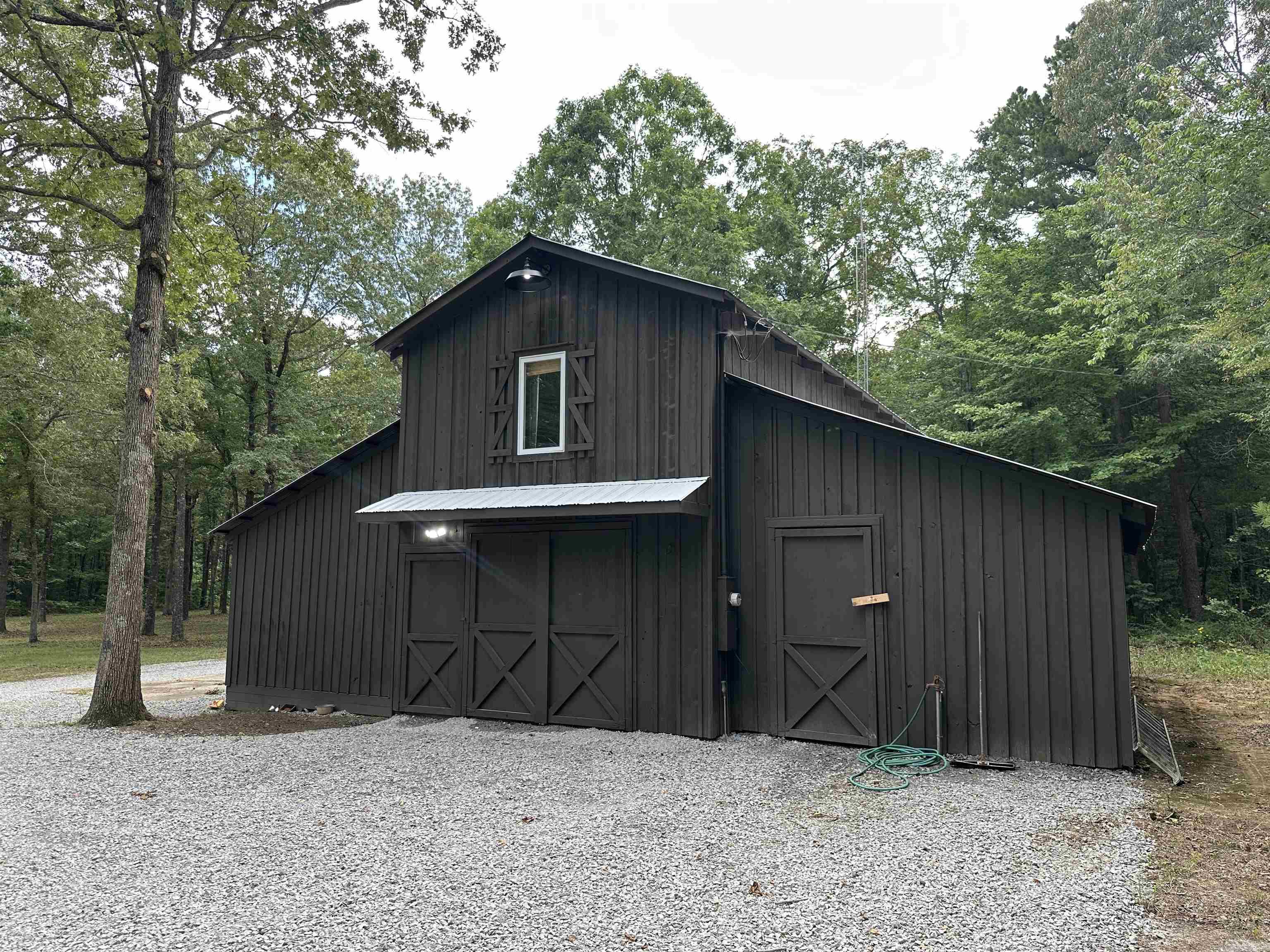 Affordable Rural Retreat with Living Quarters, Trails, and Wildlife – 43 Acres m/l near Searcy, AR This versatile 43-acre m/l property is located just 10 minutes west of Searcy in the highly desirable Ozark Foothills. Whether you're dreaming of a private hunting retreat, a small hobby farm, or a peaceful country homesite, this property has the flexibility to suit your needs. The property features 640 sq. ft. of heated and cooled living space on the upper level, complete with a furnished living room, kitchen, bedroom, bathroom, and laundry area — perfect as a weekend getaway, full-time residence, or while building your dream home. Enjoy the views and wildlife watching from the second-story deck, where deer, wild turkey, and small game are regular visitors. The lower level includes an office and spacious enclosed storage, ideal for farm tools, outdoor gear, or workshop space. Additional property highlights: -43 acres m/l of mostly wooded land with a food plot -Small field and pond – great for livestock, gardening, or recreation -Improved trail system throughout – perfect for hiking, ATV, or hunting access -Fencing on three sides for added privacy and security (agent owned)
