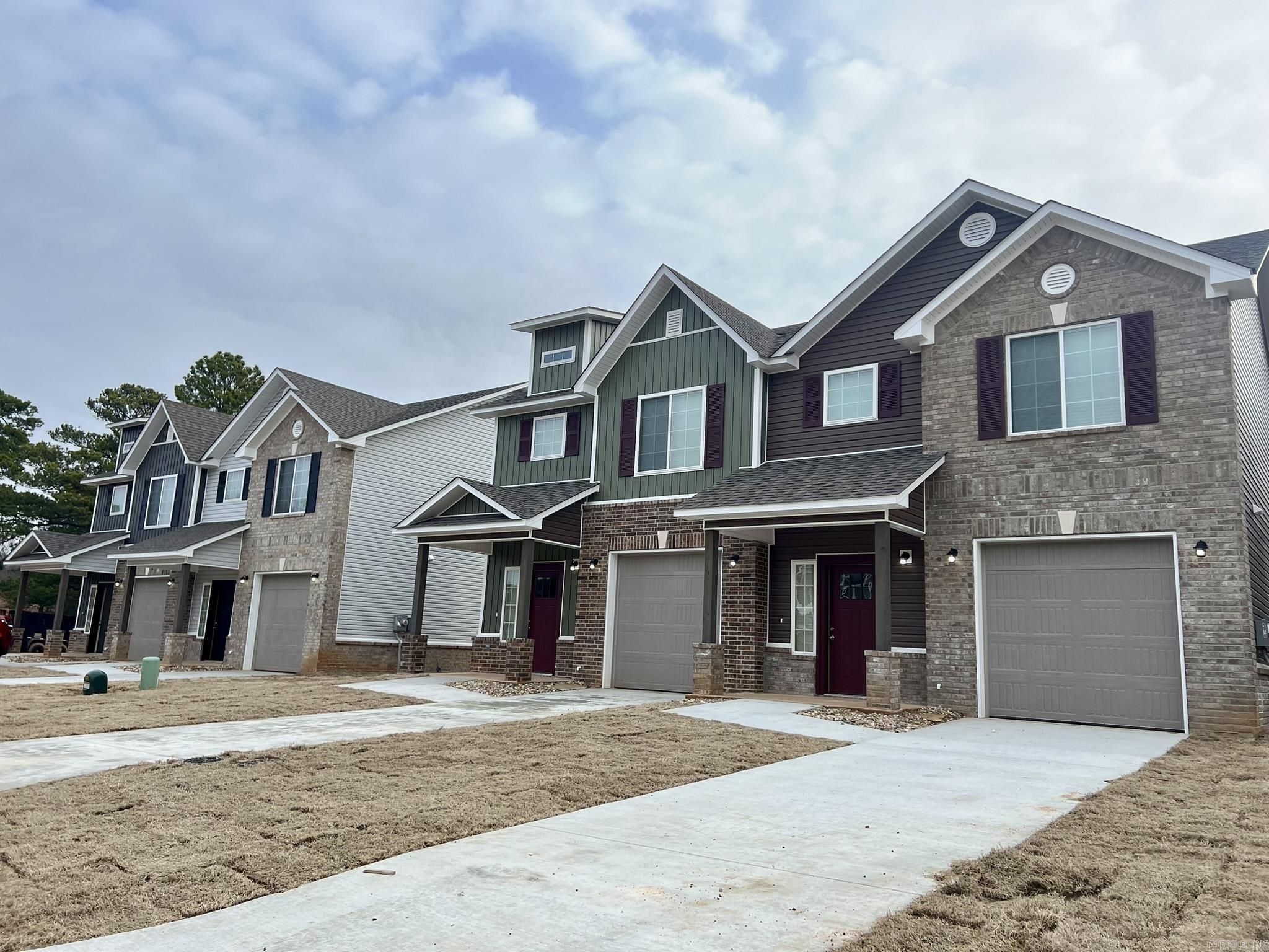 There are a total of 20 buildings, 2 doors per building. 40 rental units. Each unit is 3 Bedrooms, 2.5 baths with single garages. Garages have remote openers. Downstairs consists of: 1/2 bath, living, dining, kitchen. All bedrooms are upstairs with 2 full baths. The primary bedroom has a nice sized private bath & walk-in closet. The washer/dryer connections are upstairs as well. Each unit is 1,340 sq. ft. (per builder) with a covered patio & privacy fenced back yard. They all have interior commercial sprinkler systems. This is a huge cost saver on insurance. A wrought iron fence will be installed across the front of the property with brick columns on either side of the street with the name of the development on the columns (if not already sold before we get that built). There are 4 units that are fully furnished that rent out through Airbnb. They do very well on Airbnb. Pictures that show furnished are the Airbnb rentals. Airbnb units include washer &dryer. Furniture in Airbnb's will convey with sale. Regular rental units do not include washers & dryers. Tenants supply those. All units include: refrigerator, stove, dishwasher & microwave.
