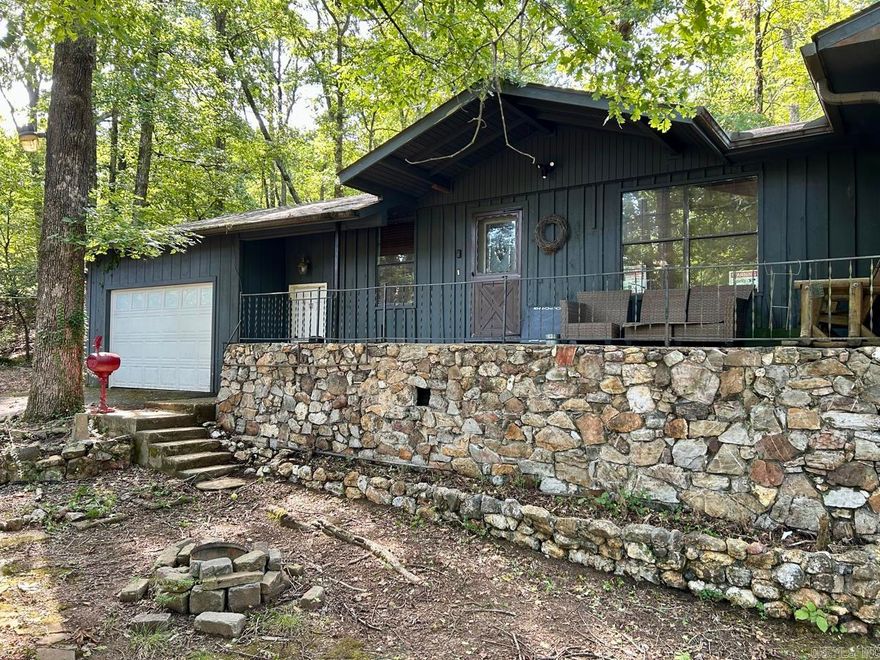 The epitome of natural living, this home is completely surrounded by trees and a flowing creek. In addition to a 3 bed, 2 bath home with a two-car garage, it also has a large detached garage that has a mechanic's pit and tons of storage space. Rounding out its unique features, it has 2 RV/boat shelters, all sitting on 1.6 acres of land. Schedule your showing today!  *Interior photos coming soon!