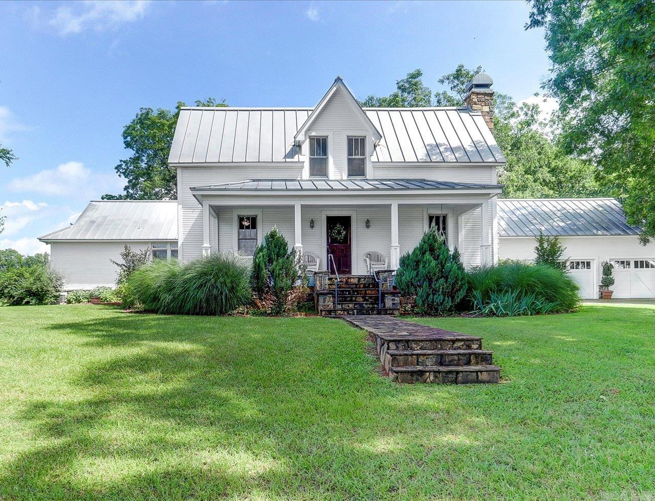 HISTORY AND LUXURY CONVERGE AT THIS 34 ACRE ESTATE JUST MINUTES FROM MT. IDA! Originally built in the 1800s by the Whittington family, this architecturally redesigned home features 4 bedrooms, 3 baths, original stone fireplaces, hardwood floors, granite countertops and updated plumbing, ductwork, and electrical - whole house. The primary suite includes a fireplace, walk-in shower, soaker tub, and dual vanities. Also includes a carpeted office or 4th bedroom and ample storage. Outside, thereās a heated saltwater fiberglass pool, flat meadows and mature trees. The property includes a 3-car garage with workshop area, a standalone workshop with half bath and barn. Additional features: standing seam metal roof, full remodel in 2003, 4 HVAC units (2 replaced in the past 2 years), 3 water heaters, irrigation system, & full house generator. Property includes acreage on South Fork River. There used to be a log cabin at the riverfront that served as a trading post/post office and there's a documented Native American burial site. This is more than a home -it's a piece of Arkansas history. All appliances & select historic items convey. Agents-schedule showings with Showing Service.
