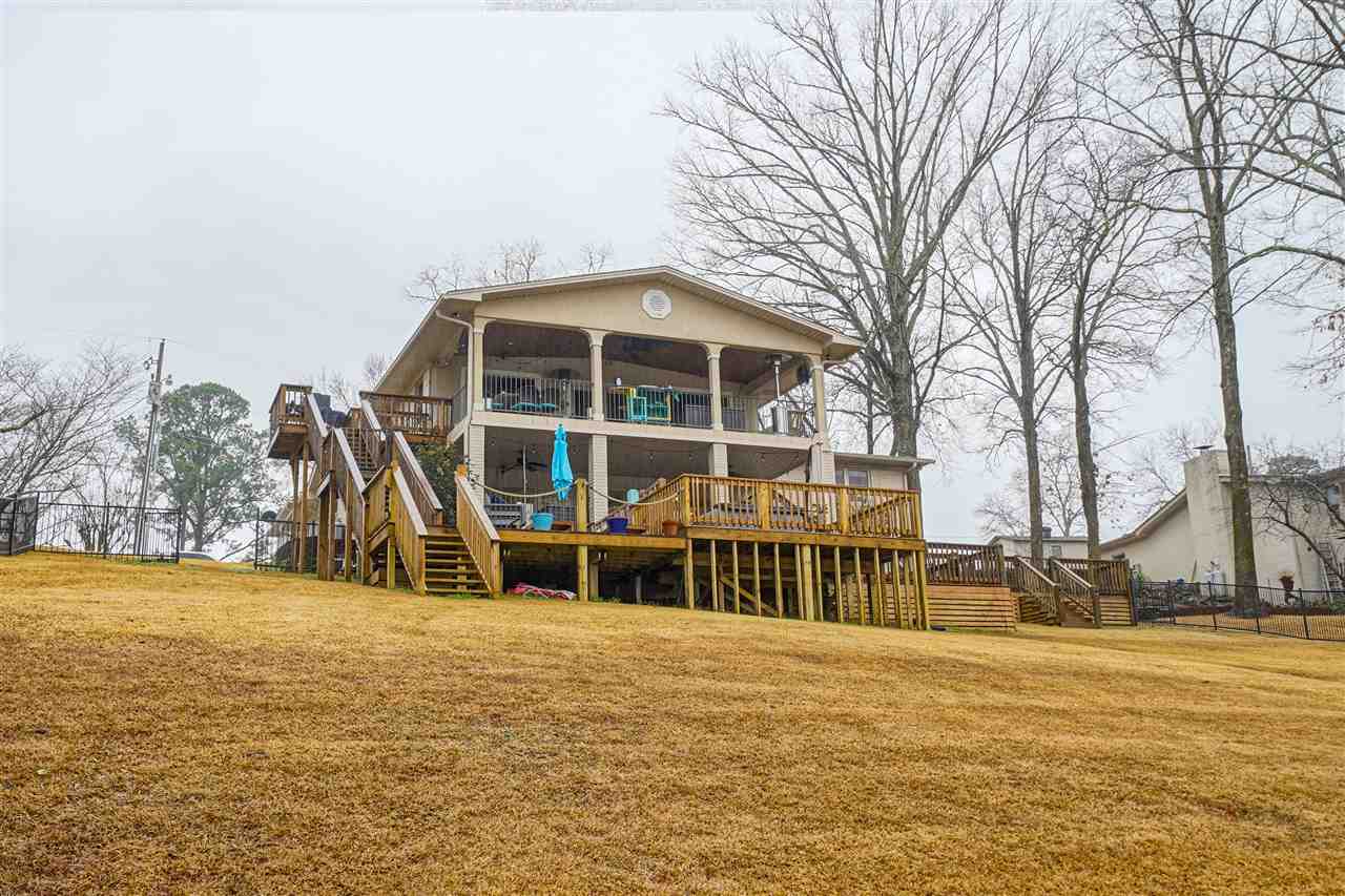 Beautiful home on Lake Hamilton! Perfect for entertaining with an open floor plan. Plenty of space to enjoy beautiful views of Lake Hamilton from upstairs and downstairs decks. Every bedroom has an attached bath, the Master suite has a huge walk in closet and a spectacular view of the lake. The two stall boat dock has extra space for storing lake toys or just lounging by the lake. Lake living at its best!