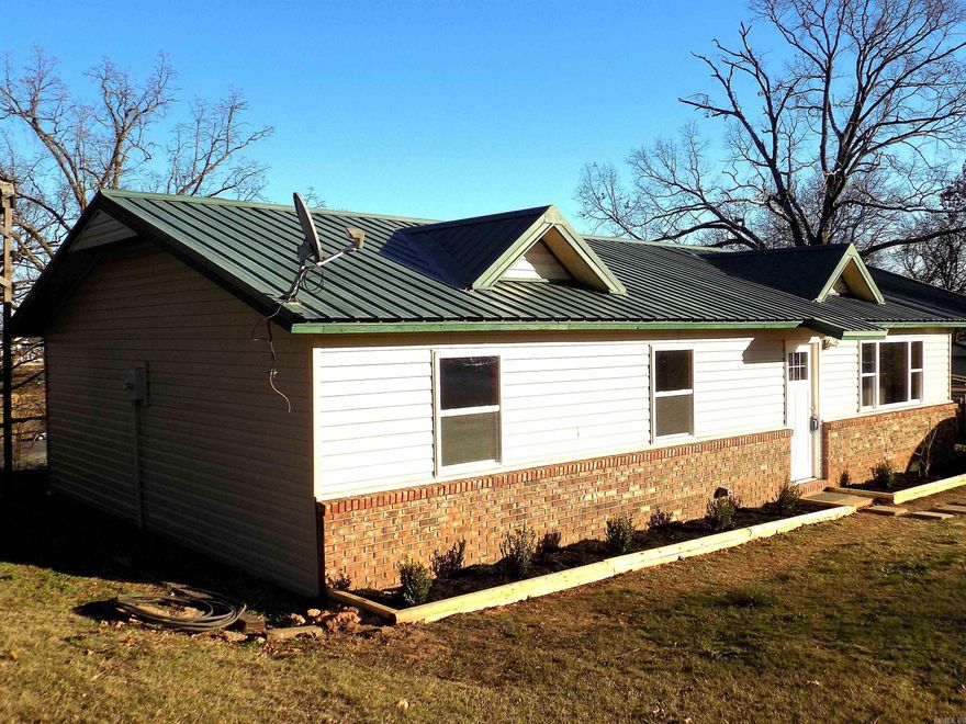 New inside totally redone.  New flooring,Paint, granite counter tops and bar.  Carport is new.  3 bedroom 1.5 baths ready for any type of loan VA, USDA,Rural Development.  New windows. LARGE  RV and  Boat storage. Land is .70  of acre plenty of space for parking.