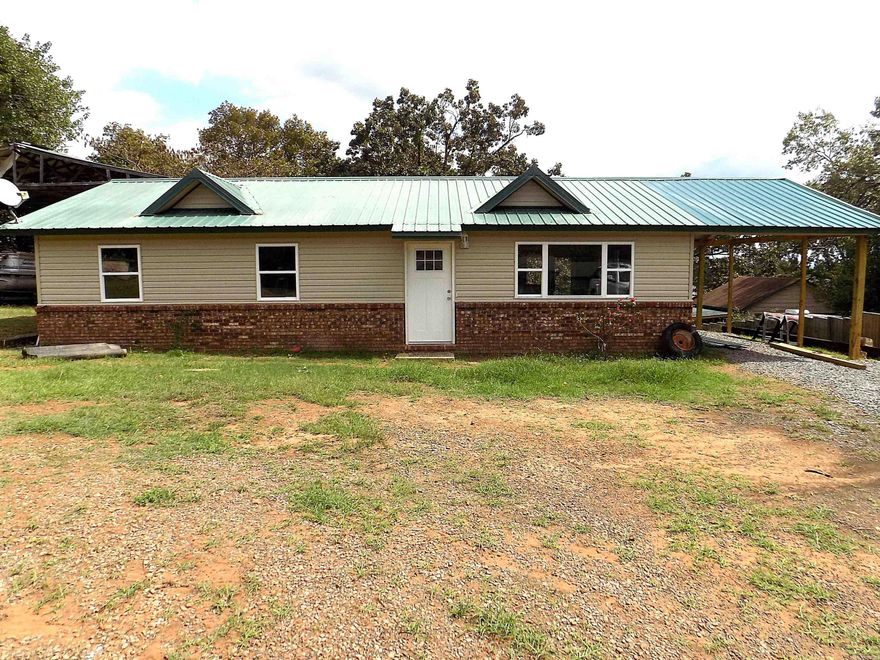 New inside a must see.  New flooring,Paint, counter tops.  Carport is new.  New windows. LARGE  RV and  Boat storage. Land is .70  of acre plenty of space for parking.