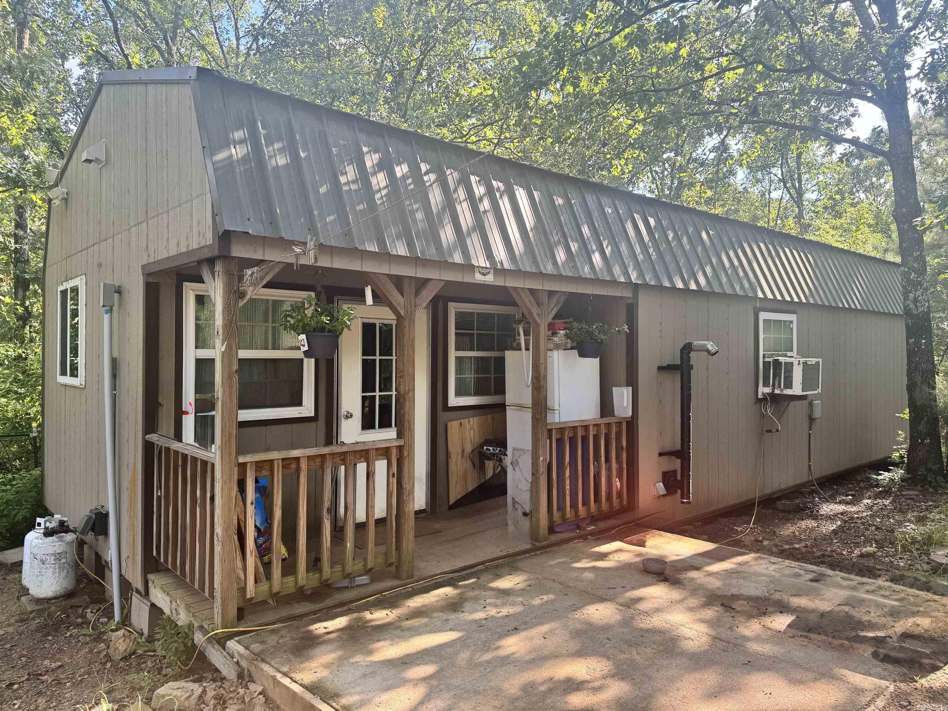 Escape the hustle and bustle on over 4 acres of unrestricted wooded bliss! Surrounded by towering trees and wildlife, this is a perfect combination of a homestead and hunting ground. This private land has a charming 640 sq ft modular building that has been updated. Seller has installed new countertops & cabinets. All appliances convey with the property, including the washer & dryer. Don't miss your chance to own a slice of the peaceful life. Priced to sell!