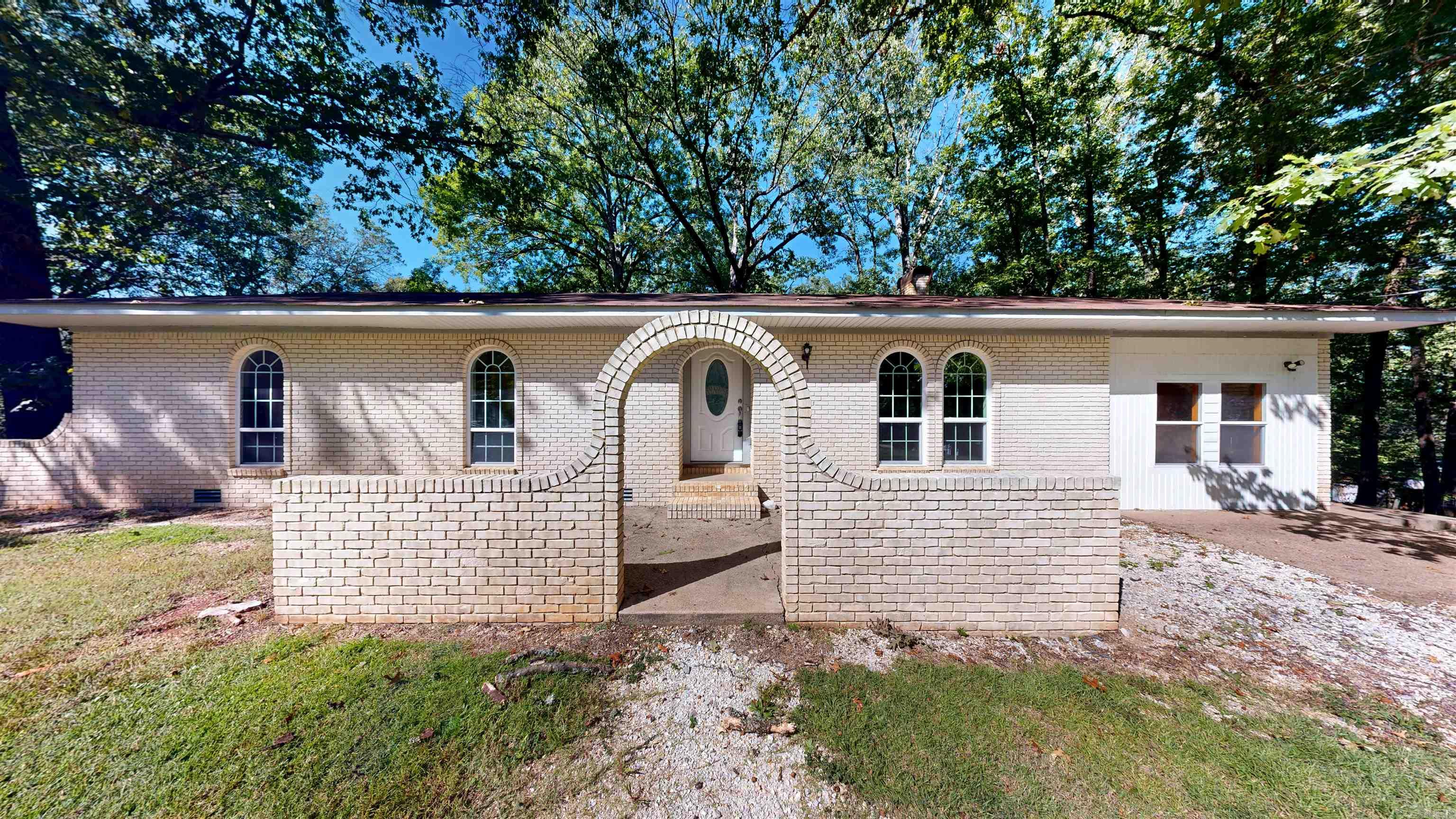 Welcome home to this charming 4-Bedroom 2 Bathroom Brick home located on a spacious 1.73 acre lot that is fully fence in the front and back yards! Gated entry! Unique arched brick entryway! windows, arched hallways! Numerous updates including new roof, new hot water heater, HVAC system 3-4 years, fireplace insert for comfort and peace of mind. Garage conversion to spacious, unique den! Additional features 1 two story shop. 1 16x16 block building in back yard. 1 covered boat cover or carport 20x25. Located in a highly regarded Magnet Cove school district, This home offers a blend of comfort, functionality, and excellent educational opportunities.