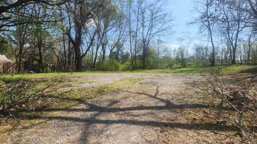 This 1/4 acre lot has a nice view of the mountains. There are no restrictions. Access to Mount Ida city water/sewer. Power is along Watkins Lane. Within walking distance of downtown Mount Ida and Mount Ida High School. There are 2 churches within walking distance as well. There are a couple of big trees for shade. The lot is fairly level. Call today for a showing.