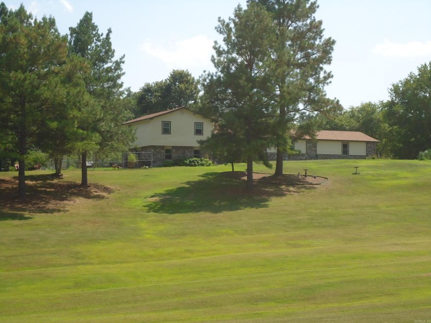 Nice tri-level ranch home siting on a beautiful 4.8-acre land tract. just off North Moore Road. 4 bedrooms and 2.5 baths. Nice size living room with large stone fireplace with gas logs and built ins on both sides. Kitchen with Bay window breakfast area. Cabinets and some appliances have been replaced in the past few years. Refrigerator, washer & dryer remain. Large combination den & formal dining area. Upper level has 3 bedrooms and 2 full baths. Lower lever and an office which could be the 4th bedroom and a large game room for entertaining. Outside concrete patio. Rear of home has a wood covered deck. Oversized 2 car garage with overhead doors. Also paved area for additional parking. Part of back yard is fenced as well as a fenced area on the west side of home. Home sits on a knoll with a beautiful view of the well-kept front acreage.