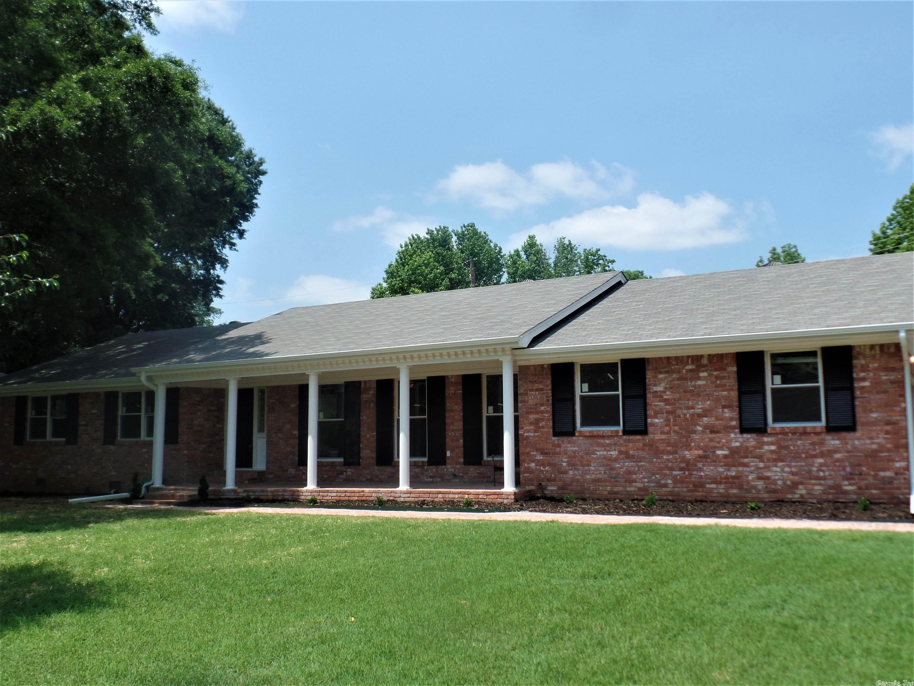 Beautifully updated and totally renovated 3BR All Brick Home on Large Corner Lot Near the Airbase--Updated Roof+HVAC System--New Exterior Paint+Trim--New Guttering--Kitchen has JennAir Cooktop Stove+Grill--New SS Appliances-Custom Cabinets Refinished/Hardware-Granite Countertops-Tile Flooring+Lighting--Sharp New Bathrooms w/ Vanities, Tile, Accessories+Lighting--New LVP Flooring in the LR +Den--Newly refinished HW Floors in the Hall+BRs--New Vinyl Windows Throughout--New Lighting Throughout--BONUS: Natural Gas Powered Home Generator--2 Car Garage-Openers--Office--Large Laundry Room--Outside Storage Building