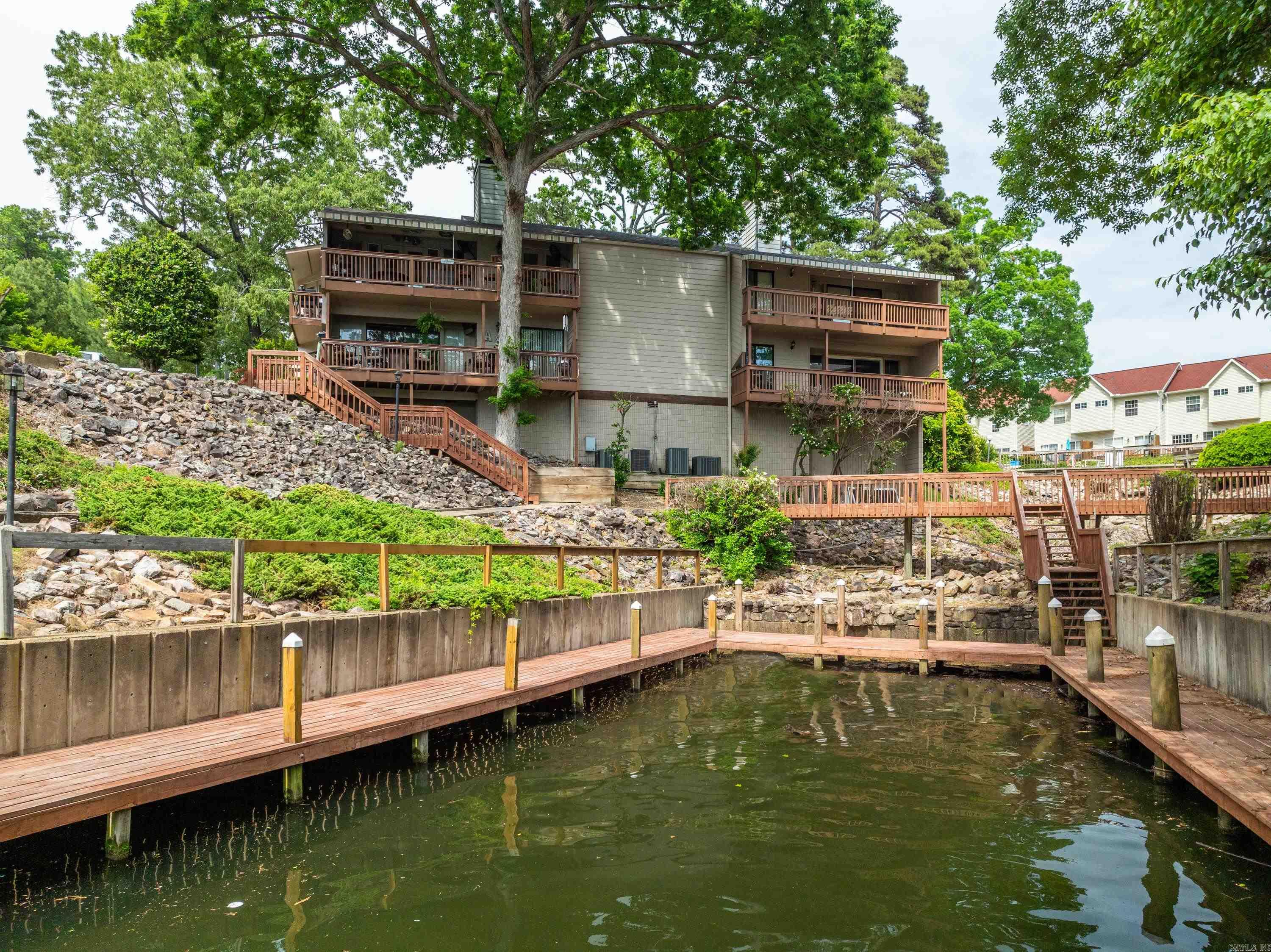 WELCOME to your dream lakefront getaway in Hot Springs, Arkansas. This FULLY furnished walk in level 2 bed, 2 bath condo offers the perfect blend of comfort and convenience for both vacationers and investors seeking a short-term rental opportunity. Enjoy breathtaking views of the serene lake right from you own balcony, and indulge in the array of amenities this resort-style community has to offer. Whether you're looking for a relaxing retreat or a lucrative investment, this condo has it all. HVAC unit 2 years old. Don't miss out on this rare chance to own your piece of paradise in this sought-after location.