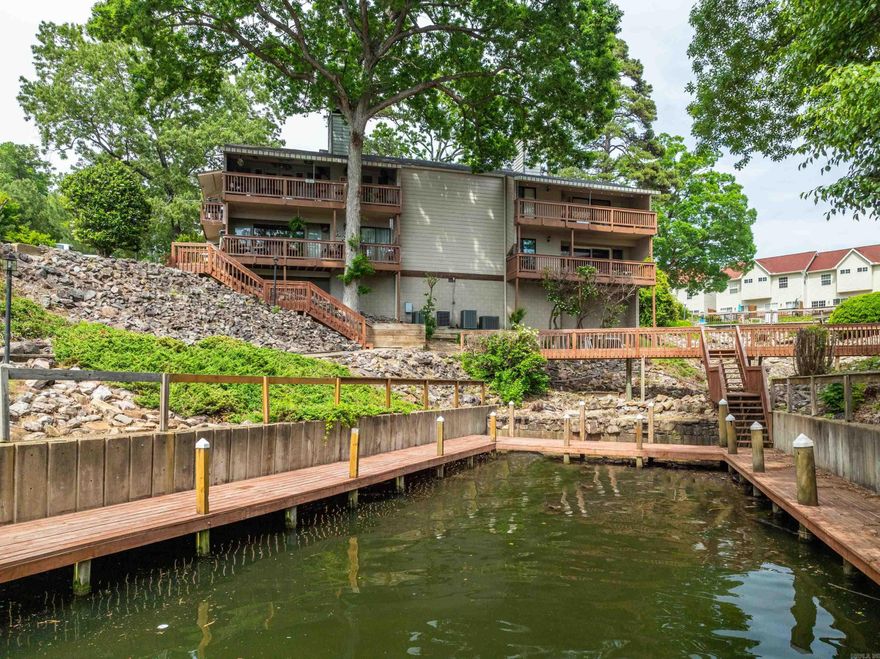 WELCOME to your dream lakefront getaway in Hot Springs, Arkansas. This FULLY furnished walk in level 2 bed, 2 bath condo offers the perfect blend of comfort and convenience for both vacationers and investors seeking a short-term rental opportunity. Enjoy breathtaking views of the serene lake right from you own balcony, and indulge in the array of amenities this resort-style community has to offer. Whether you're looking for a relaxing retreat or a lucrative investment, this condo has it all. HVAC unit 2 years old. Don't miss out on this rare chance to own your piece of paradise in this sought-after location.