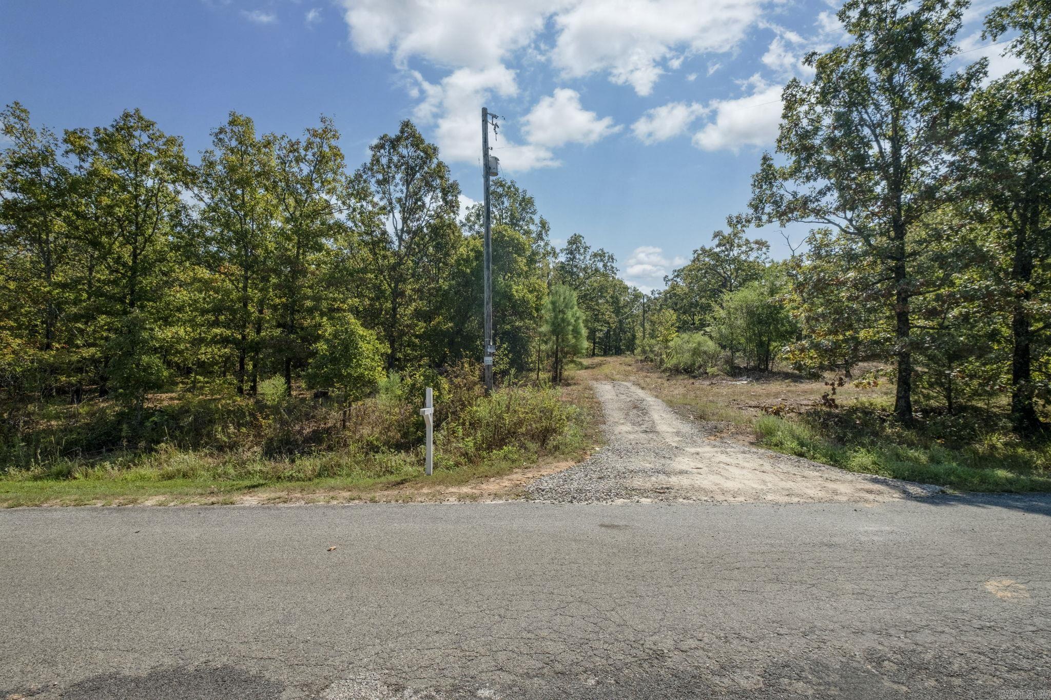 Beautiful lot for your next home! Private area with great views and NO RESTRICTIONS! Close to Cabot but outside of city limits. Electricity on the property and water at the road.