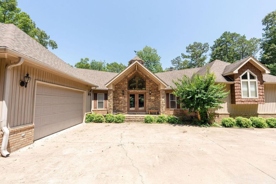 2.02 ACRES LAKEFRONT,  BOAT SLIP with LIFT IN COMMUNITY DOCK short drive away, Golf Course,  What else could you ask for.  Large lake home approx 4442 sf, 4 bedrooms, 4 baths, large garage, 2 fireplaces.  Lake views from every bedroom.  Wet bar and game room lower level, decks and patios galore.  FIRE PIT!!  Lots of room for entertaining. Airstrip nearby for you pilots.  Home could also make a great vacation rental. Rare Find for the area and priced to sell.