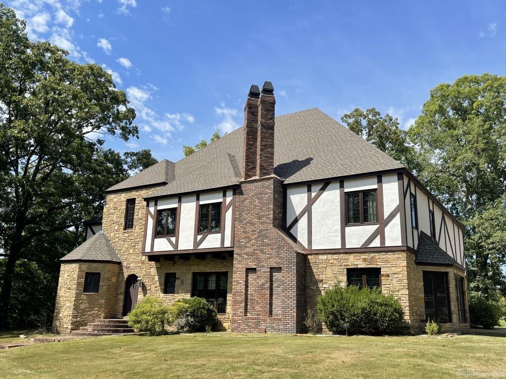 Architect-designed by Rick Bowles and masterfully built by Jim Sugg, this 4BR, 3.2BA estate is a timeless retreat on 3.14 acres with sweeping water views. Soaring 9-ft ceilings, heavy crown moldings, and rich stained-glass details set a tone of elegance, while Mexican tile, marble baths, and custom finishes showcase quality craftsmanship. The chef’s kitchen features a Sub-Zero refrigerator, built-in ice maker, triple stainless sink, pantry, and premium appliances. Entertain in style with a wood-ceilinged pool room and included pool table, or unwind on the patio overlooking a private fishing dock. The expansive layout includes a large utility room with island, two flexible storage/bonus rooms, and a floored 4th-level space. A Cyprus-lined double garage, additional 2-car garage, and a 3-year-old roof complete this exceptional property. Designed for both grand entertaining and everyday luxury, this residence blends classic sophistication with unmatched comfort.