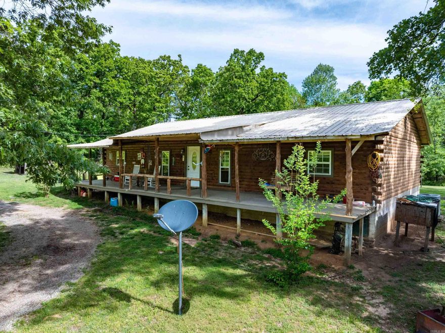 Secluded 20± Acre Log Home in Sharp County, AR – Just Minutes from Cave City Escape to the Ozarks with this private 20± acre homestead located just off Highway 115 and only 10 minutes from Cave City, Arkansas. This 4 bedroom, 2 bathroom log home offers the perfect mix of seclusion and convenience, sitting back off the road in a peaceful setting surrounded by mature timber and abundant wildlife. Enjoy relaxing on the full-length covered front and back porches while watching deer and turkey roam. Inside, you’ll find an open-concept living, dining, and kitchen area ideal for gatherings, along with a warm, rustic log interior. The property includes a large shop for equipment or hobbies, a garden spot, fruit trees including an apple tree, and plenty of room for outdoor activities like hunting or ATV riding. A bonus mobile home (in need of full remodel) offers potential for guest space, rental income, or multi-family living. With a private setting, usable acreage, and proximity to town, this Sharp County property is perfect for a full-time residence, weekend retreat, or investment opportunity. Call today to schedule your showing!