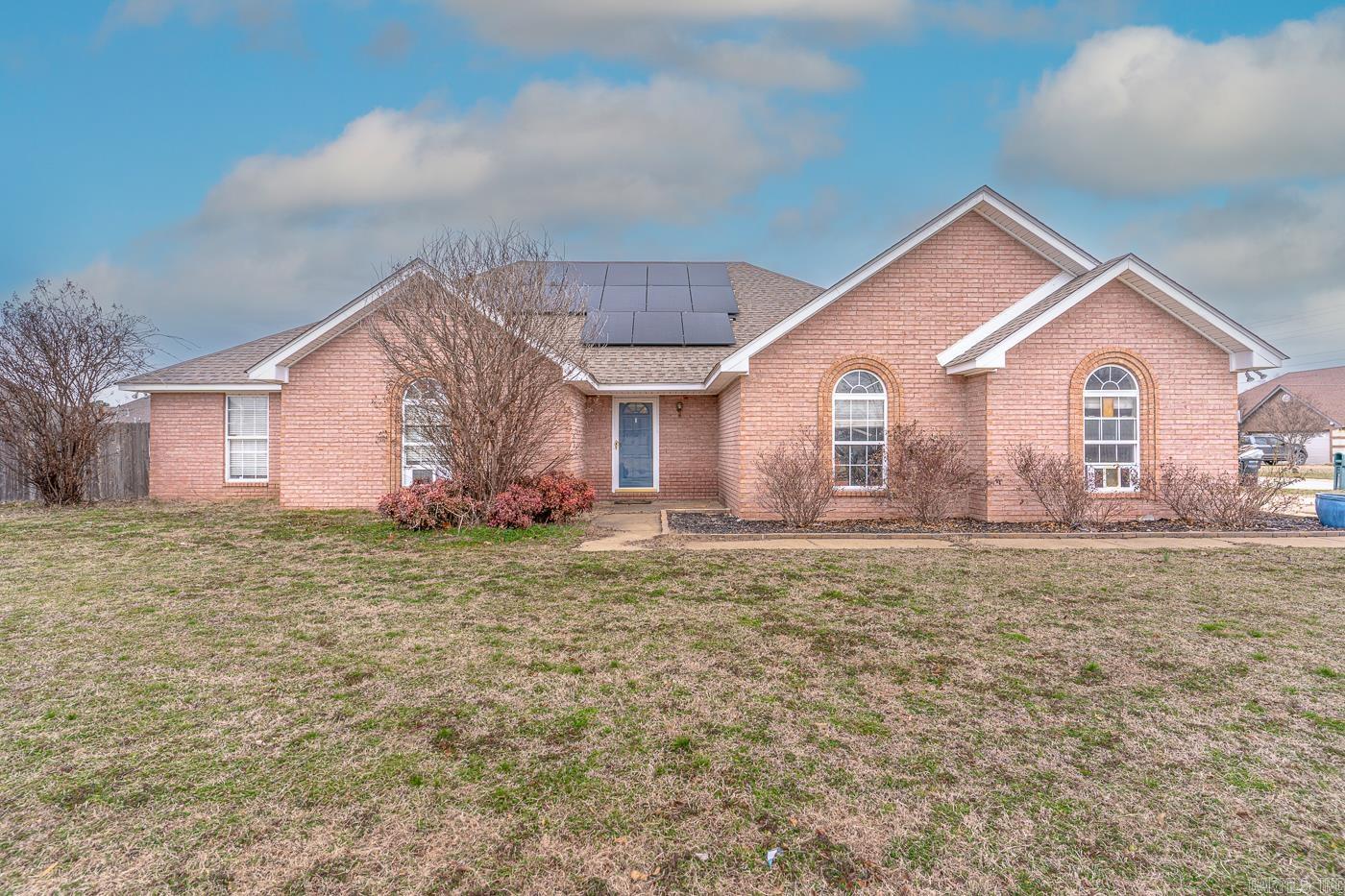 Welcome to Market: 601 Primrose Ln of Trumann, to Poinsett County, of the Trumann Public School District. If you’re looking for a solar panel array, designer color choices, and at least one wall mural, then you’ve found your new home. There’s plenty here from the two-car garage and spacious corner lot to the classic red brick exterior. The front door opens onto a great room showcasing a coffered ceiling and a blue and gray color scheme. The galley kitchen boasts gray cabinetry, a small island, a door to the garage, and a door to the back yard. The primary bedroom offers an en-suite bathroom with a double vanity, walk-in shower, and a jetted tub. But of the three remaining bedrooms, don’t miss the fairy room. The walls are covered with a magical forest and a literal tree house. These designs can’t be found in any store. These are custom. This property sits in the middle of Trumann, close to everything. The high school is only 1.7 miles away, 1 mile from Walmart, and 1 mile from I-555 which leads to Jonesboro, Memphis, or anywhere else you might want to go. If you’re looking for lots of space and thoughtful design choices, you’ve found it. Call today to schedule your private viewing.