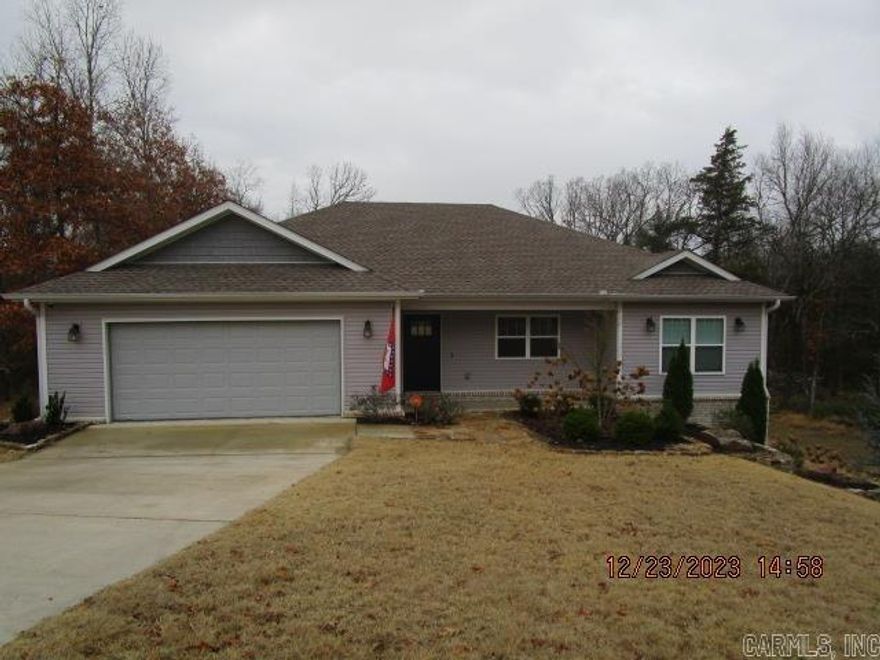 Very well maintained home near Wal Mart and other shopping with easy access to Hwy 67/167 and Hwy 5.  1841 sqft on almost two acres in the city limits.  Lot is sloped but opens up to a huge backyard that is a great place for children to play or for outdoor entertaining.  Laminate vinyl plank flooring throughout, granite countertops, tile backsplash, large kitchen island, lots of storage.  Master bedroom has separate tub and shower with a large walk in closet.  Split floorplan with large open kitchen, dining room, and living room great for entertaining.  Backs up to greenspace sit on the back deck and watch the wildlife. Property has a creek that flows most of the year.  Large roll up door to huge underneath storage area.  Nice landscaping with rock edging.  See agent remarks.