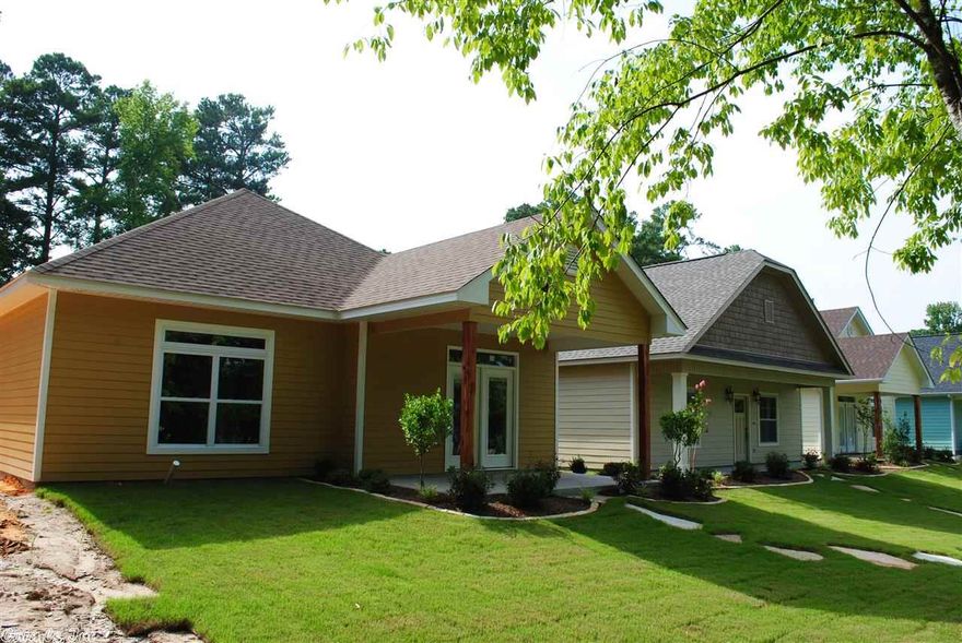 Beautiful like new garden home in The Arbors at Andres Place in Bryant. 3br 2ba home includes a greatroom w/ gaslog fireplace, ceramic tile flooring, kitchen/dining combo w/ granite countertops, breakfast bar, stainless appliances, custom stained cabinetry, master suite with jetted tub, separate stand/sit shower, double granite vanities, large walkin closet with built-ins, rear-entry garage, huge front porch overlooking courtyard and so much more!!!