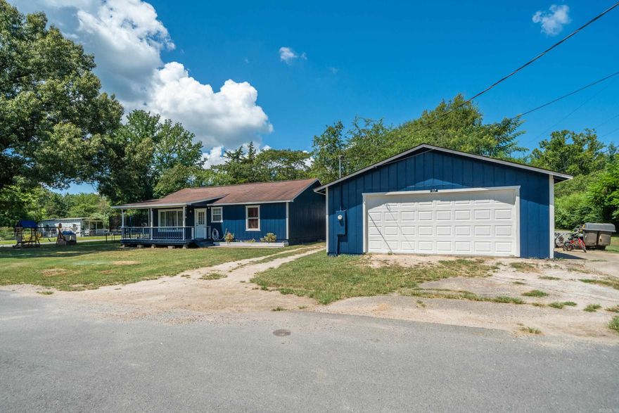 Welcome to this freshly painted 2-bedroom, 1-bath home nestled on a spacious corner lot in the heart of Mountain Pine, AR. Built in 2010 and thoughtfully updated, this all-electric gem offers the perfect blend of comfort and functionality. Step inside to find a bright and open floor plan with vaulted ceilings and laminate flooring throughout. The heart of the home is the oversized kitchen featuring custom natural wood cabinetry,as well as a large island bar, ideal for casual dining or entertaining. The living area is flooded with natural light from large windows and offers a warm, inviting space to gather.  The home boasts several recent upgrades, including: HVAC (approx 2 years old), Roof (approx. 5 years old) ,Hot Water Heater (approx 3 years old), Electrical & Plumbing (both updated approx 3 years ago),Outside, enjoy a covered front porch perfect for relaxing, a flat grassy yard, and a detached 2-car garage/shop, ideal for hobbyists or additional storage. Located just minutes from Lake Ouachita and Hot Springs National Park.