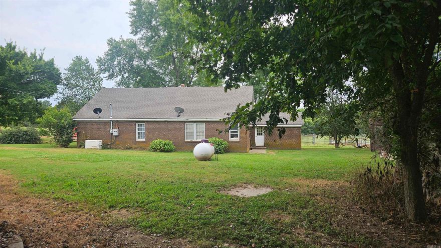 Location Location Location, Brick country home on 1.32 acres with 2 larger barns and 2-5000 bushel grain bins. Home is in need of some repairs. Home will not go Rural Development or FHA loans. This home requires cash or a bank loan, only. Home is just minutes from town but with peace and quiet. 36 x 45 barn with dirt floor , has 2 large sliding doors and one walk through door. 30 x 20 barn/ shop with roll up door and a walk through door. Home has a large living room and large kitchen. Lots of kitchen cabinet and lots of storage area. Roof is less than 5 years. Extra bathroom off the mud room is not used and not in proper working order.