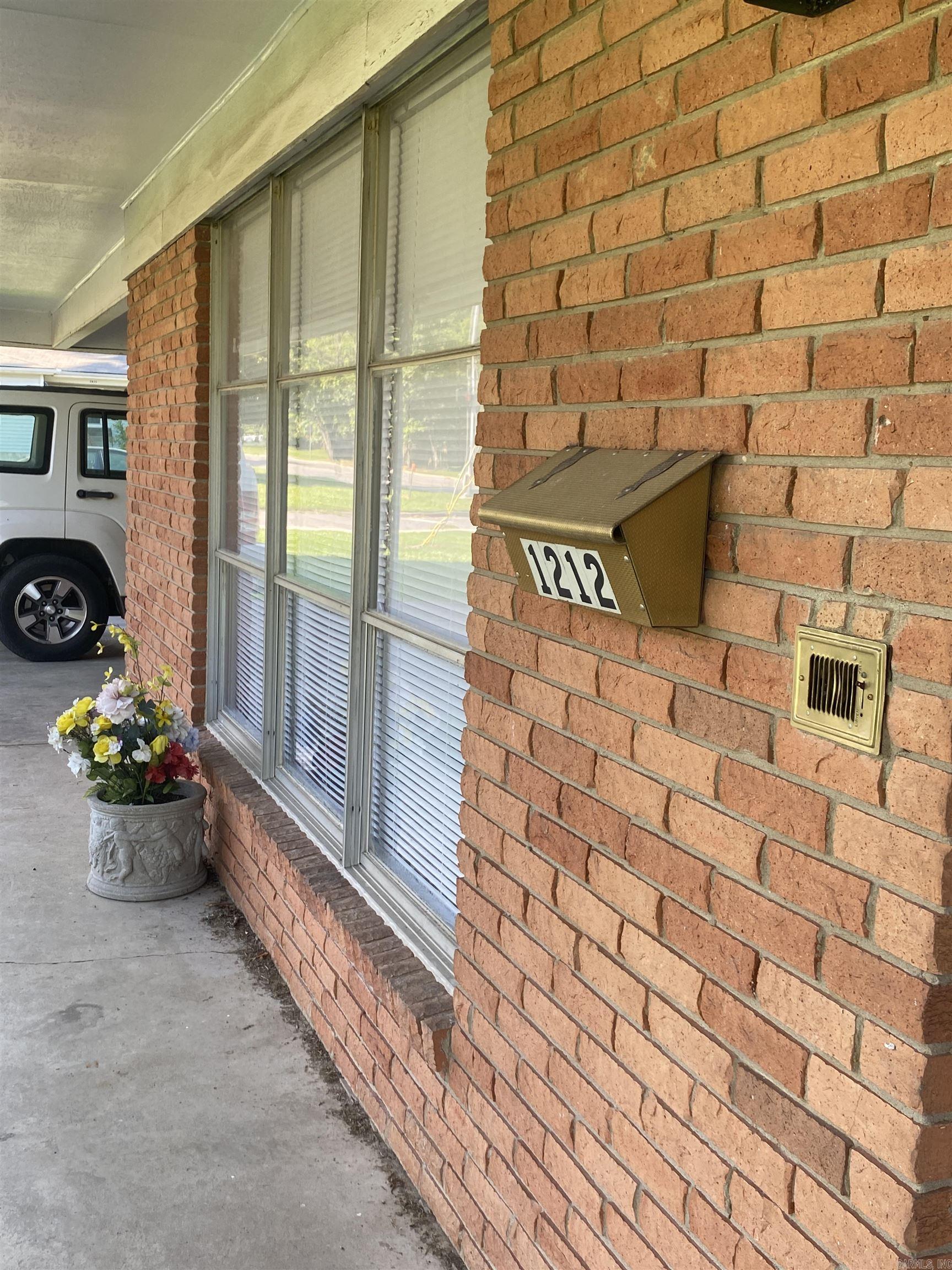 Huge corner lot in the city limits of Conway. It is located on the corner of Donaghey Ave. and Lee Ave. The home has good bones to it but has not been up dated. Seller is selling the property as is. Greet place to have room for a garden or a shop.