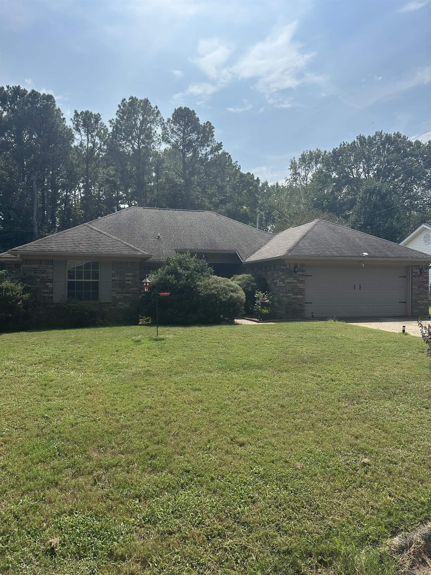 Nestled on a spacious 1/4 acre lot, this beautifully updated 3-bedroom, 2-bath home offers the perfect blend of comfort, style and country living. Located in a quiet subdivision, the property provides a serene escape while still being just a short distance from all the local amenities. Step inside to find an inviting living room with updated flooring and a fireplace. The modernized kitchen features beautiful cabinetry, built-in china cabinet and updated appliances---ideal for everyday living and entertaining. The primary suite includes a private bath, while two additional bedrooms offer space for family, guests or a home office. Outside, enjoy the expansive yard with room to garden, play, or just relax under the open sky. A large outdoor storage building provides plenty of space for tools, equipment or hobbies. Don't miss this move-in ready gem with plenty of room to grow, both inside and out.