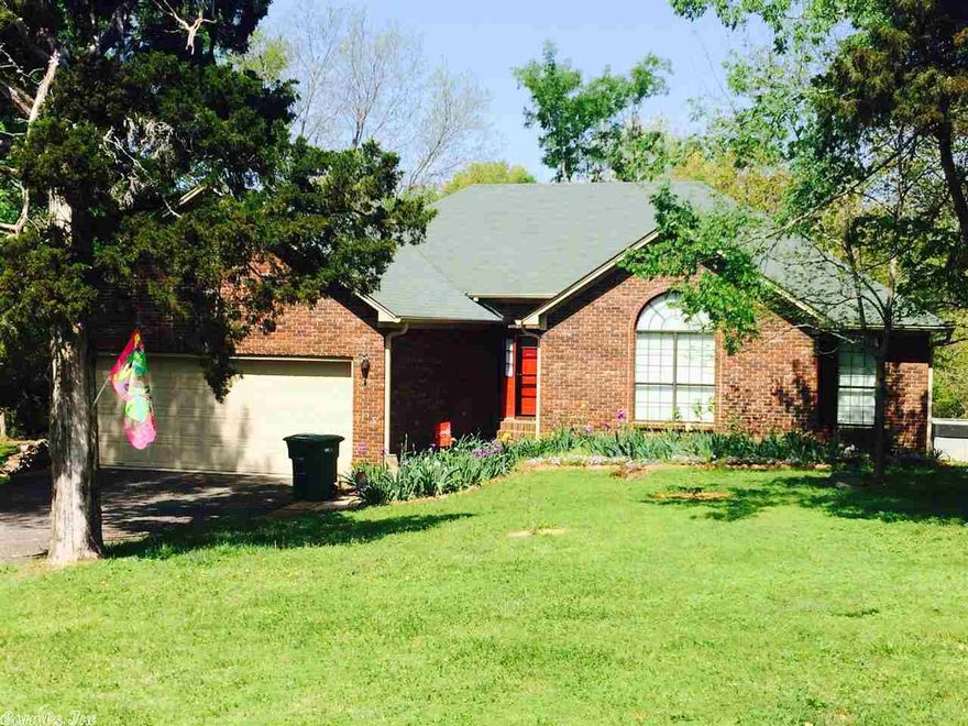 Brick home on partially cleared usable 4.75+\- acres with a gorgeous view of an amazing creek that runs the length of the property that even has a swimming hole. 1800 sq ft 4 Br 2 Ba, eat in kitchen, dinning area, fireplace in living room, too many updates to list. 2 car garage, shop.