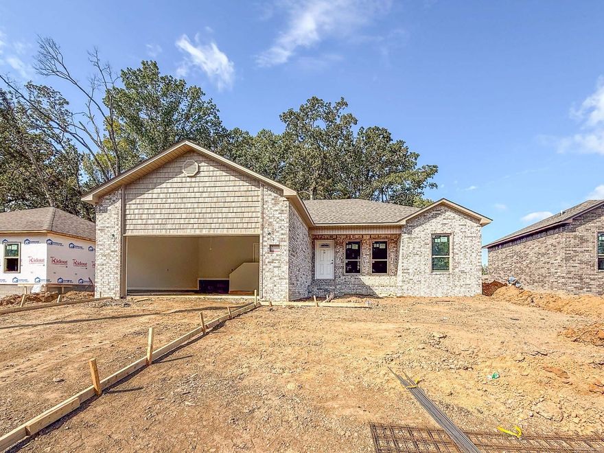 Country living with city convenience! Discover the perfect blend of tranquility and accessibility with this stunning new construction all-brick home, ideally situated for those who cherish the peace of country living yet desire the conveniences of the city. This spacious home offers 4 bedrooms and 2 baths, providing ample space for family and guests. The island kitchen is a chef's dream, featuring granite countertops, painted cabinets, extra trim, and a stylish backsplash. You'll also love the abundance of storage space, perfect for stocking up your pantry. Enjoy the spa-like walk-in tile shower and double vanities, offering a touch of elegance and functionality. Equipped with cabinets, the convenient laundry room provides both convenience and additional storage. Experience the beauty and durability of luxury vinyl flooring throughout the home — no carpet, ensuring low maintenance and a modern look. Please note that this home is currently under construction, allowing you the opportunity to envision your future in this beautiful space.  Make it yours today!