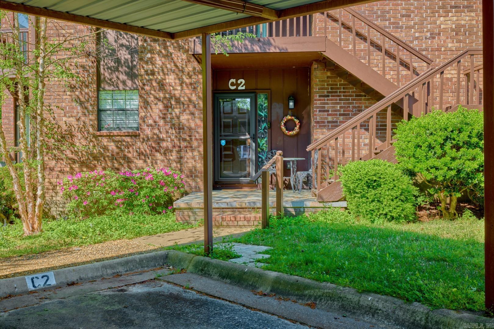 Ground-floor condo on Lake Hamilton with lake views, three private patios, and a serene, park-like setting. This beautifully updated 2-bedroom, 2-bath unit features an open floor plan, quartz kitchen counters, upgraded cabinets, and a pantry with pull-out drawers. The living area flows seamlessly for easy entertaining and includes a dual-sided fireplace shared with the spacious primary suite. The primary bedroom offers two closets, a renovated en-suite bath, and patio access for enjoying lakeside mornings. No short-term rentals allowed, ensuring a quiet and neighborly atmosphere. The community includes a lakeside pool, covered parking, and beautifully maintained grounds. Located minutes from shopping, dining, and expressway access, this move-in-ready home offers the best of lakefront living in Hot Springs.