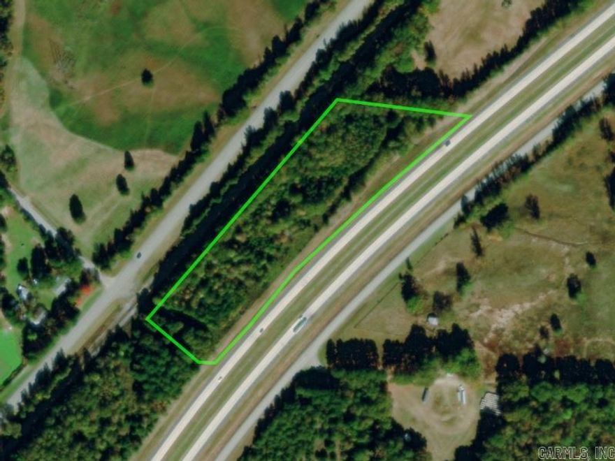 7+ acres lying between Hwy 67 and Hwy 367 in Russell. Partially cleared with highway frontage. Bald Knob School District. Trailer with large white and red sign is on the property facing Hwy 67.