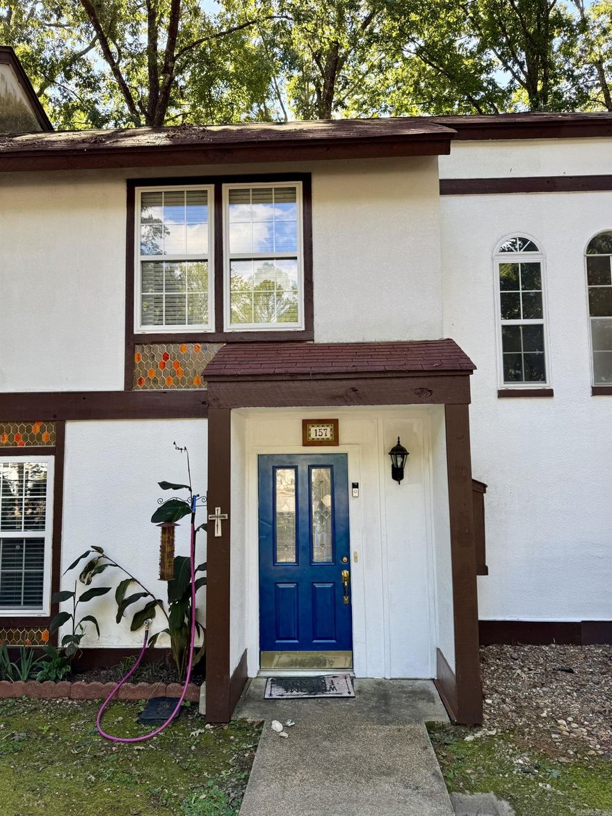 Move-in ready townhouse just 5 minutes from the West Gate! Offering 1,028 sq. ft. of comfortable living space, this 2-bedroom, 1.5-bath home has been updated throughout with new LVP flooring, carpet in bedrooms, fresh paint, blinds for the sliding door, new light fixtures and extra insulation in the attic. The kitchen and bath feature new sinks and fixtures, countertops and all new appliances (less than 5 years old) are included. Enjoy your morning coffee on the private back deck with peaceful, treehouse-like views of the woods. Tucked away in a quiet cul-de-sac, this home combines comfort, convenience, and charm.