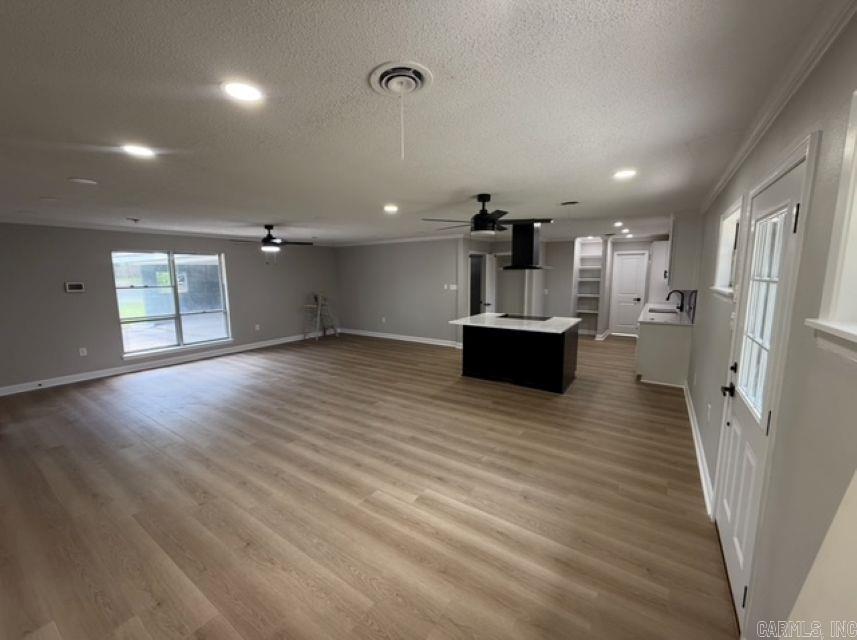 Beautiful move in ready renovated 3 Bedroom, 2 Bath home features an open floor plan with recessed lightning, fresh interior and exterior paint, all new flooring, and stylish updates throughout. The stunning kitchen showcases a beautiful island, new countertops, backsplash, sink, cabinetry, and modern fixtures. Both bathrooms offer new vanities and sleek black hardware. You'll also find new interior doors and a clean, contemporary design from top to bottom.