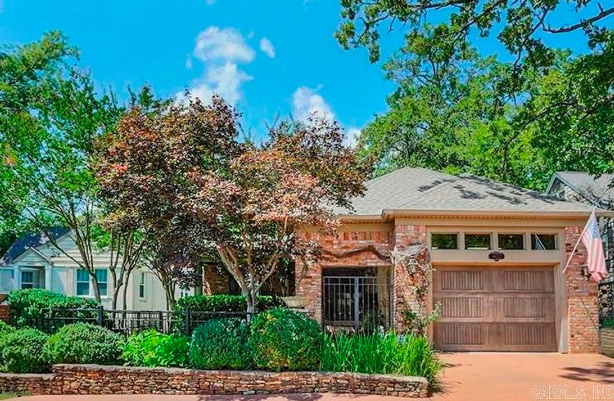 New Orleans style patio home just blocks from CCLR.  This one level home has full house generator & a one car garage that is covered into the home. Formal spaces great you as you enter the front door.  The formal living room has a beautiful fireplace & the windows are aligned with planation shutters, also beautiful hardwoods throughout most the house. The primary bedroom is in the back overlooking and opening up to the fenced backyard, fully landscaped. Enjoy relaxing under the pergola or on the covered porch with heaters.  Primary bath features a large window overlooking the private garden with both a whirlpool tub & a large shower, vanities, and nice sized walk in closet.  Beautiful quaint kitchen with wonderful appliances open to the hearth room with fireplace.  The kitchen is sunny & bright!  Nice sized laundry is easily accessible from kitchen & has extra storage. Two other bedrooms & two baths make up the rest of the home. Currently one of the bedrooms is used as a breakfast room & has outstanding storage for china & crystal & other entertaining items. This elegant home is the perfect answer to downsizing while still having a beautiful home for entertaining family & friends!