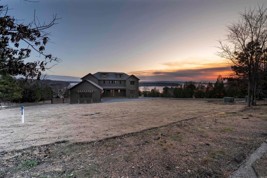 Lake Luxury, Discover your dream home w boat slip at Greers Ferry Lake! This stunning 4-bedroom, 3.5 bath, hosting 2-master suite residence offers breathtaking lake views from every level. Enjoy private escapes on your expansive upper & lower decks, featuring many windows & glass doors for unobstructed vista views.  Inside, you'll find high-end finishes throughout, including, delta & Kohler fixtures, quartz countertops, stainless steel KitchenAid appliances, wine & drink coolers, Ice machine, custom OPI-stained cabinetry, Anderson windows, & a striking 3 panel Southernwood glass front door allowing an 8ft wide opening to allow the outside air in & vise versa, The open-concept living space features 12mm wood flooring, a floor to-ceiling propane fireplace, and a tankless water heater for efficient comfort.  With over 3,200 square feet of heated and cooled living space & a massive under-roof area of nearly 7,100 square feet, this home offers ample room for entertaining & relaxation. The minimal landscaping & convenient lakefront easement make it easy to enjoy the outdoors. The Furniture, decor and boat slip can be purchased outside of the home sale. Call for details.