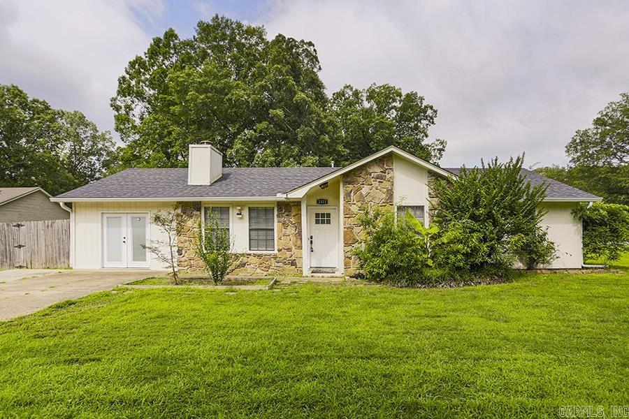 Welcome to this charming and cozy home located on a desirable corner lot in an established Bryant neighborhood, within a sought-after school district. Enjoy the convenience of being close to schools, parks, shopping, and easy highway access. This delightful residence boasts a newer roof (2019) and modern appliances, including a stainless steel gas range with double oven, microwave, refrigerator, and dryer, all updated in 2022. Inside, you'll find laminate flooring throughout the living room and bedrooms, complemented by a vaulted ceiling that enhances the spacious feel. The living area is graced by a stunning wood-burning fireplace with an elegant stone frame, perfect for creating warmth and ambiance. Step outside to discover a fully fenced backyard, featuring a generous screened covered patio, with concrete pad next to it, ideal for entertaining or relaxing with family and friends. The property offers two storage buildings for all your organizational needs. Large room next to the living room could the 4th bedroom. This home qualifies for RURAL DEVELOPMENT LOANS. Don’t miss out on owning this delightful home in a fantastic location—schedule your visit today!
