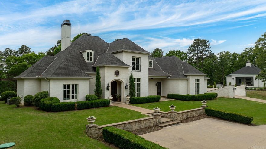 Breathtaking custom home set atop a stunning 5.5AC mountaintop setting offering privacy, views, and exceptional indoor and outdoor living. Designed with both elegance and function in mind, the home flows effortlessly thru-out. The gourmet kitchen features Thermador appliances, handcrafted island accents, and generous cabinetry, opening to inviting living spaces with a fireplace and wall of windows overlooking the landscaped grounds. The main level primary suite is privately positioned with two closets and a refined bath, while two guest bedrooms share a jack and jill bath. Upstairs offers two additional guest bedrooms and a spacious bath. The current owners have made enhancements, including adding an impressive family room with fireplace, custom built-ins, and access to a 420sf home gym/4th garage bay. An oversized detached three car garage was added with a 440sf bonus room and storage. Outdoor living is exceptional with an in ground pool and a beautifully designed 735sf pool house offering a 580sf covered patio with fireplace, grill, and hot tub, plus a kitchenette, full bath, stacked laundry, and flexible living/sleeping space. Main house 4918sf +1585sf additional.  Come see!