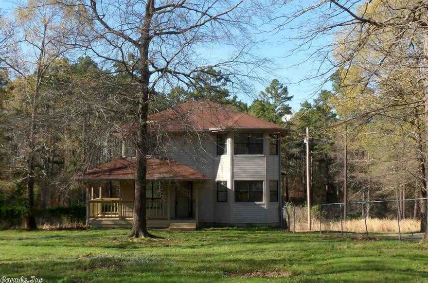 ADORABLE TWO LEVEL RANCH STYLE HOME SITUATED ON ACREAGE WITHIN THE LAKE HAMILTON SCHOOL DISTRICT. HOME FEATURES AN INVITING COVERED FRONT PORCH, LIVING ROOM, DINING, KITCHEN, BEDROOM, BATH AND A PRIVATE REAR DECK ALL ON THE MAIN LEVEL. MASTER BEDROOM WITH BATH, GUEST BEDROOM AND FULL BATH ARE LOCATED ON THE UPPER LEVEL. HUD CASE #031-352028, FHA FINANCING: IN (INSURED), PROPERTY IS SOLD IN AS IS CONDITION, NO WARRANTIES, GUARANTEES OR REPRESENTATIONS.