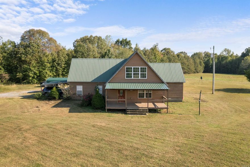 Ready for Life at the End of the Road? Welcome Home! This country cabin look home is a 3-bed, 1-bath, approx 2,208 sq ft home situated on approx 14.65 acres boasting 2 spacious shops, a small pond and more! Entering the home one notices the large living room w/vaulted ceilings and significant natural light w/a delicate balance of light & dark tones. Just off the living room is the galley style kitchen w/ample storage and large enough for two refrigerators. The home has a dining and living room combination. Two bedrooms are downstairs and one bedroom upstairs. Outside the home one can enjoy covered front and rear porches to take in the country scene and wildlife. Need to store your toys out of the elements? Well, this property has a large 40x50 shop w/bay doors and also has a large 25x30 two car detached garage/shop too! The property is approx 14.65 acres mainly fields but has some tree coverage too w/small pond also.  You will want to checkout all the potential this could have for you!  Come view the home and property and make an offer!  See Agent Remarks.