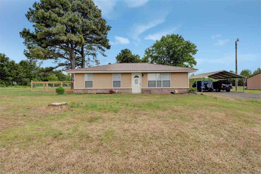 Stunning 3 Bed/2 Bath home in the country on 4.28 acres! Home was completely remodeled within 5 years. Kitchen/dining combo w/ breakfast bar, Beautiful wood-grain tile throughout kitchen and living area. Spacious Master bedroom with enormous walk-in closet. Brand new fence out the back of home. Huge 2 bay shop with loft, electric, and water. Make this Country Home yours!!!!