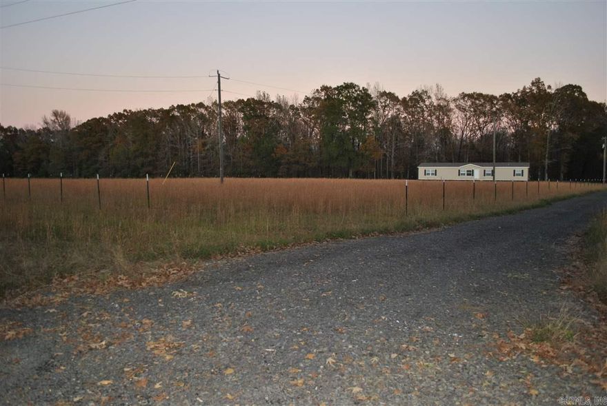 Approx 7.21 acres composed partial and partial woods. Water, septic, power hook-ups on site. Existing mobile will be removed prior to closing. Survey and disclosure available.