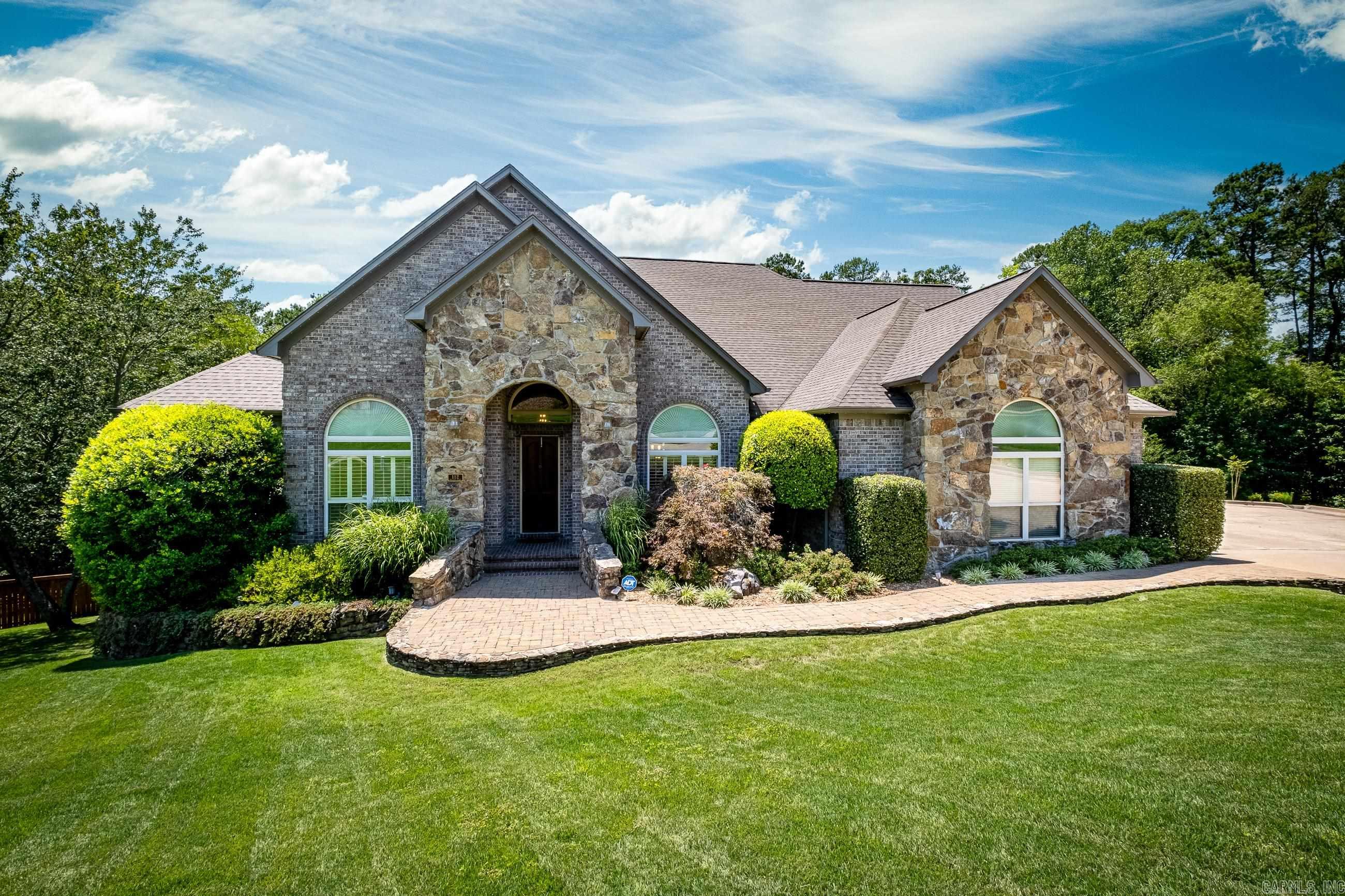 Beautiful Villages of Wellington home on over half an acre that backs up to greenspace. This home features soaring ceilings, high-end finishes, tons of windows for natural light, and beautiful views from the deck. On the main level is the luxurious primary suite with spa-like bathroom and walk-in closet with built-ins. You won't want to miss out on the gourmet kitchen featuring granite counters, large island with second sink, double ovens, and gas range. Also on the main level are two additional oversized bedrooms with Jack-and-Jill bathroom, office, laundry room with sink, and half bathroom. Upstairs is one bedroom, full bathroom, bonus room with wet bar, and large heated/cooled storage room (not pictured). Three-car oversized side-load garage. Updates include: new main level engineered hardwood flooring and bathroom tile 2023, HVAC 2022, Gemstone exterior home lighting 2022, kitchen appliances 2020, main level paint 2020, newer roof and tankless water heaters. Entire house generator (inspected/serviced winter 2022). There is ample storage throughout the house, floored attic space, and crawlspace storage. *Offers will be reviewed 7/10 at noon*