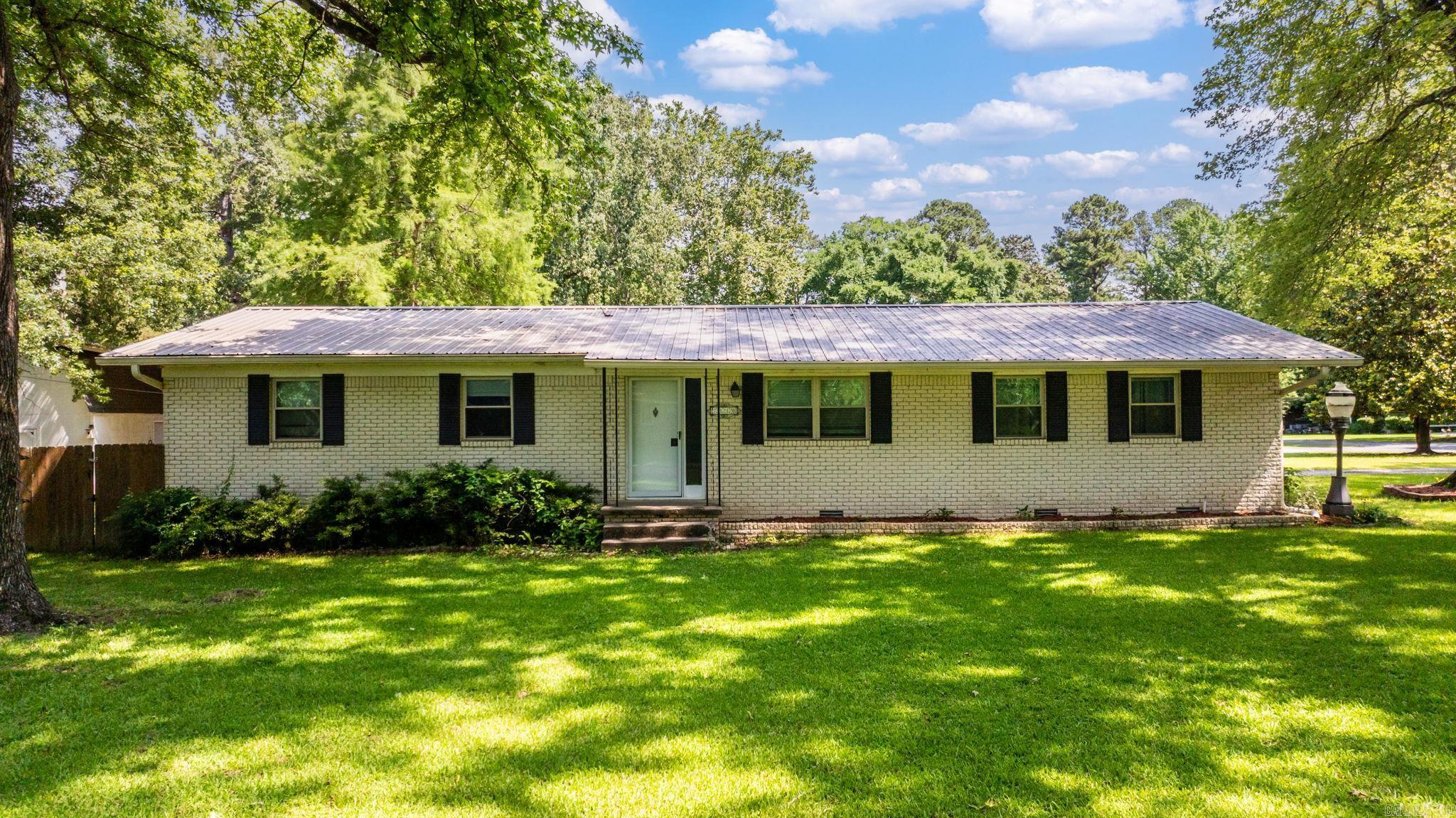 This totally remodeled home is move in ready! New granite tops & cabinetry 2019. Wood look laminate floors & refinished wood floors in 3 bedrooms. Metal roof, large deck, huge shop with electricity. Park like setting with large trees & extra landscaping. New HVAC 2025. Chicken coop is negotiable.