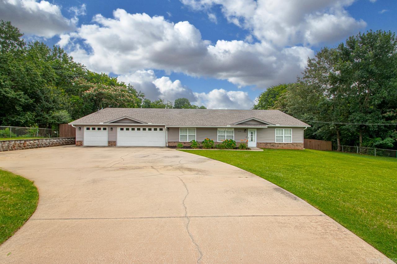 Discover this beautifully updated and spacious home at 1235 Odessa Haskell in Benton, AR! The main house features 3 bedrooms and 3 full bathrooms, including two master suites—ideal for multi-generational living or extra privacy. A separate 2 bed/1 bath mother-in-law suite or income-generating apartment—with its own private entrance—offers unmatched versatility. The stylish kitchen boasts custom cabinets, and the primary master includes a walk-in closet with a built-in electric safe. A natural gas generator adds peace of mind, and the new roof provides lasting value. Enjoy summer fun with an above-ground pool in the fully fenced backyard, plus a 21x12 wired shop perfect for hobbies or storage. A spacious 3-car garage provides ample parking and workspace. Located in a quiet, established neighborhood, this unique property is the perfect blend of comfort, function, and flexibility. Don’t miss this one-of-a-kind opportunity!