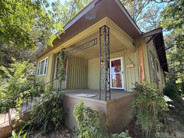 Step into this charming 1900s Craftsman-style Bungalow, where classic elegance meets modern convenience. Inside, you'll find two generously sized bedrooms connected by a Jack-N-Jill bathroom, plus an additional half bath, all enhanced by impressive 12-foot ceilings. Located in the heart of Hot Springs, this bungalow is just a stone's throw from the excitement of Oaklawn Casino Resort and the scenic beauty of Downtown Hot Springs. Imagine starting your day on the 12x15 screened-in porch, complete with enclosed storage underneath. Surrounded by lush, shade-giving trees, this home offers a peaceful retreat while still being close to all the action. Ready for you to move in or use as the perfect vacation getaway, this bungalow combines historic charm with an unbeatable location.