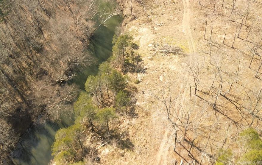 45 ACRES with CADRON CREEK Frontage and a Small Cabin with well water, septic and electricity. Public Water and Fiber Internet available at the road.  This is a must-see property on a beautiful stretch of deep water on the North Cadron Creek. Multiple other building sites available on this property or just utilize this amazing property for recreation and hunting.  I've seen deer on every trip so far and 2 wood ducks landed in the creek. More Acreage available and some acreage can be purchased without the cabin.