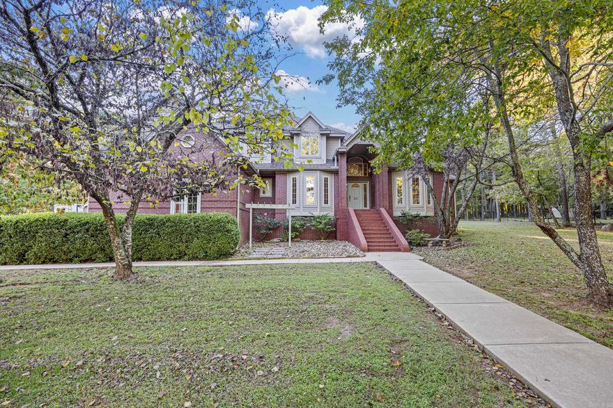 4 BEDROOMS • DETACHED SHOP • IN-GROUND POOL — CLIFF & STREAM Located in one of Russellville’s most desirable neighborhoods within the Pottsville School District, this immaculately maintained 4-bedroom, 3.5-bath home offers over 3,100 sq. ft. of refined living and quality craftsmanship around every corner. The main living room features floor-to-ceiling windows that fill the space with natural light and create a grand, welcoming feel. The hearth room with built-ins offers a cozy retreat connected to the kitchen and breakfast nook, where a kitchen window overlooks the sparkling pool. The kitchen includes granite countertops and timeless finishes. Step outside to your private paradise with an in-ground pool, pool house with kitchenette and bath, and a detached shop perfect for hobbies or a man cave. With tons of storage throughout this home, a attached three-car garage, and move-in ready perfection, this home delivers elegance, comfort, and location all in one.