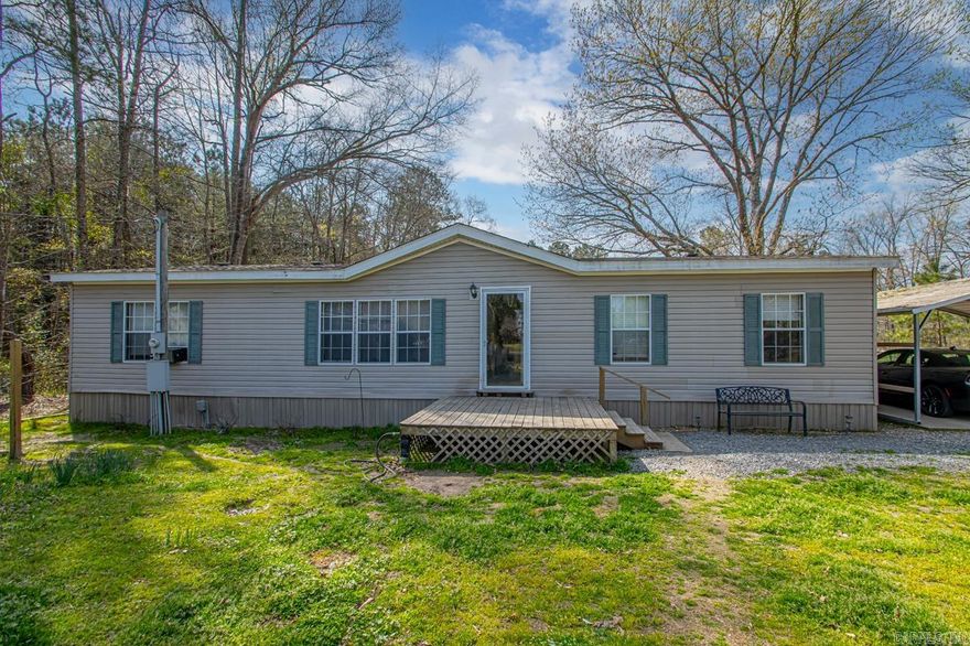 ***Serene Rural Retreat*** with endless possibilities. Located on 1.2 private acres just outside of Haskell. This 2013 Lexington doublewide home features 4 spacious bedrooms and 2 baths. 1680 SF with newly upgraded flooring in kitchen and dining area. Central Heat/Air. Screened-in back porch plus an expansive 16x20 patio for outdoor entertaining. 2-car carport with cement pad and electricity. Covered concrete pad for boat storage, also with electric. Huge 18x21 Shop with slab, and wired with 220 wiring for hobbyists and DIY enthusiasts! New roof in 10/23!! Fenced kennel for pet owners! Perfect blend of rural peace and modern convenience! (Agents! See Agent remarks)