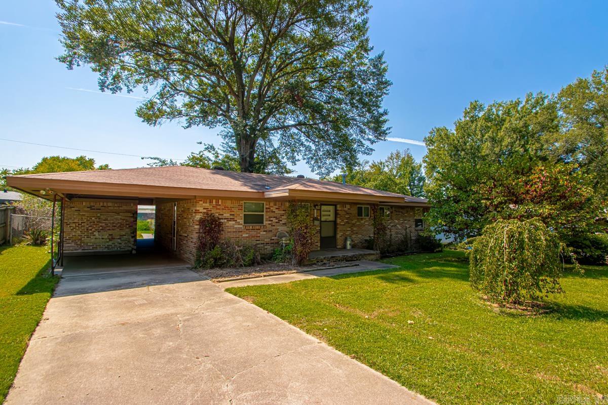 Don't miss out on a chance to own and fix up this wonderful home! The level lot has great yard space in the front and the back. There is a one car carport that also has a storage room for the washer and dryer. You will notice the original hardwood floors and the nice space this home provides. There is lots of natural light when you pull back the curtains to the sliding glass door. Agent's see remarks!